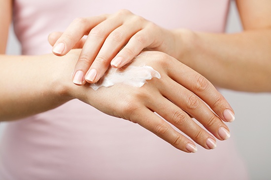 Consumer care application, hands applying lotion